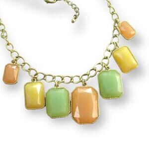 Pastel gold tone necklace with pale orange, green, and yellow dangles